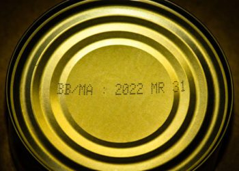 Overhead shot of a Tin Can of Tuna with Expiration date.